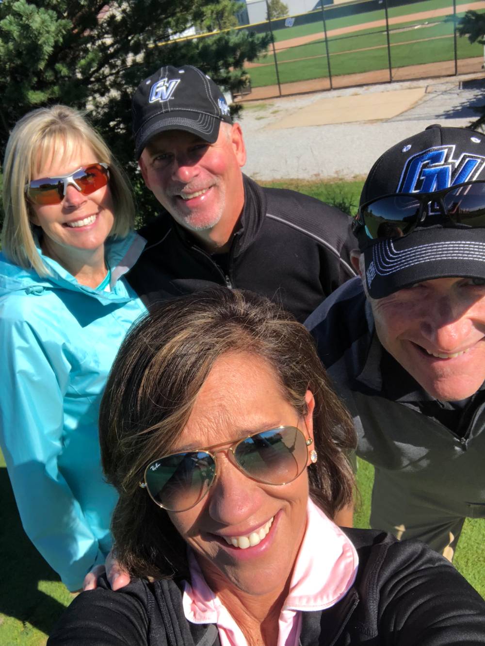 Alumni take a selfie at the golf outing
